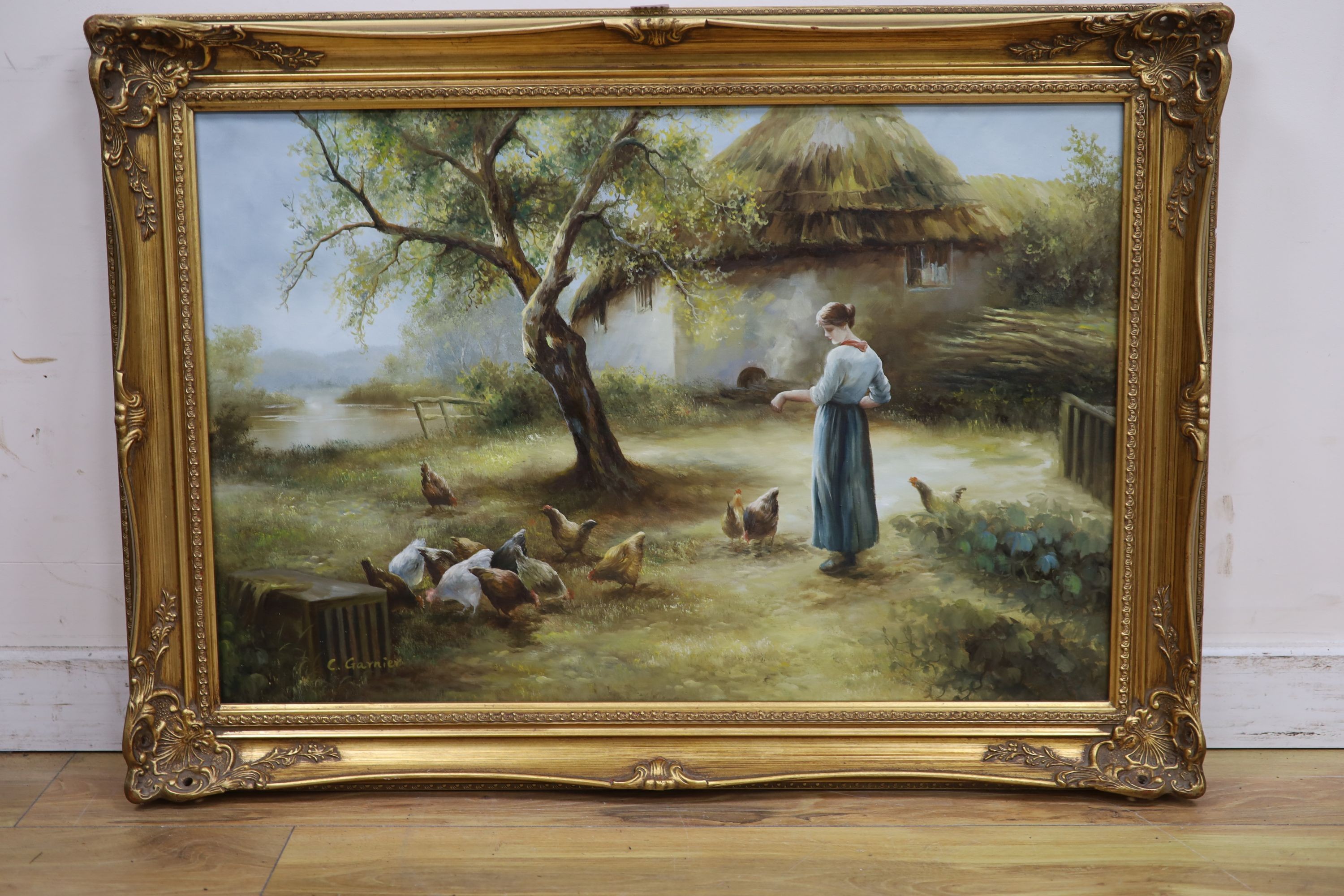 C. Garnier (20th century British), oil on canvas, ‘’Feeding the chickens’’, signed, 50 x 76cm.